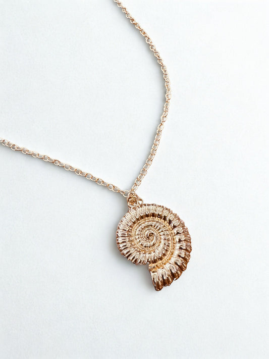 Nautilus Shell Pendant Necklace Elegant, dainty and minimal jewelry perfect for everyday wear. Handcrafted gold and silver jewelry from Erica Jewelry India collection.
